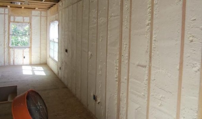 Drywall or playwood over the layer of insulation